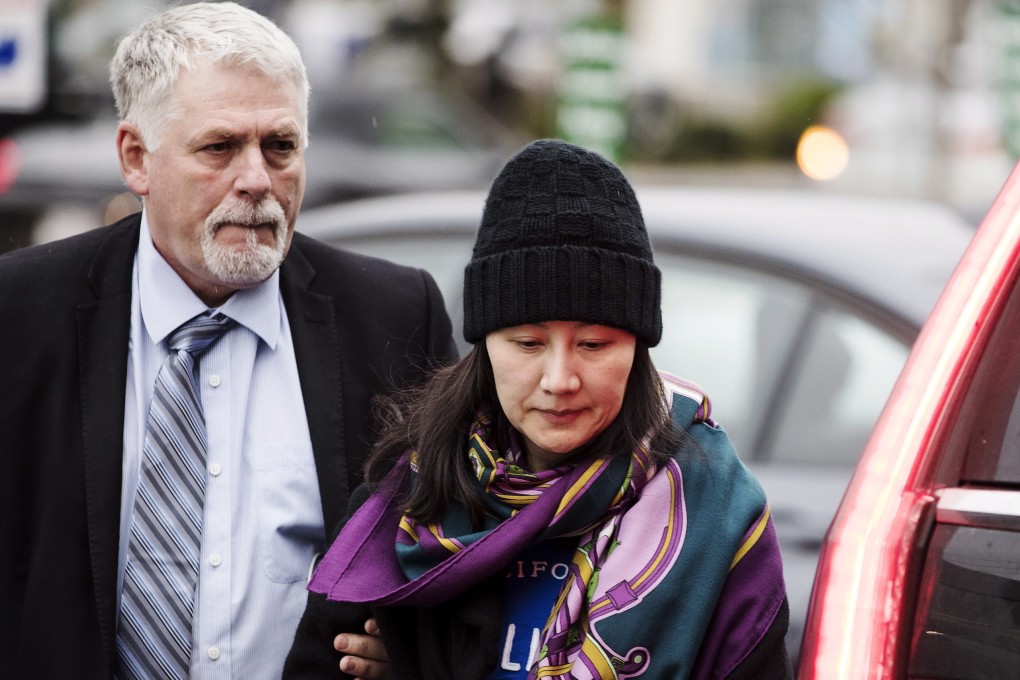Huawei chief financial officer Sabrina Meng Wanzhou arrives at a parole office with a security guard in Vancouver, British Columbia, part of her bail arrangement with the Canadian authorities. Photo: AP