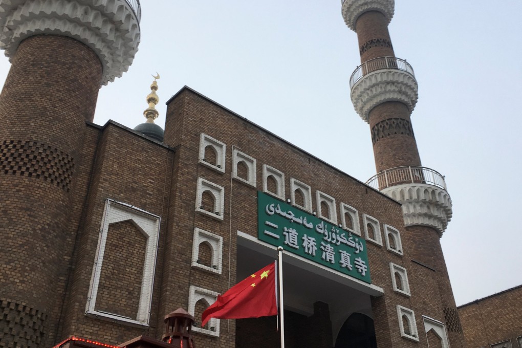 The Chinese national flag flies outside the mosque at the Xinjiang International Grand Bazaar in the regional capital Urumqi. Photo: Reuters