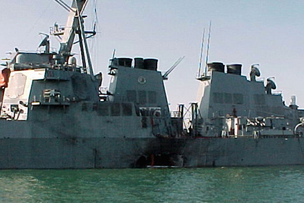 This file photo taken October 12, 2000 shows the port side of the guided missile destroyer USS Cole damaged after a suspected terrorist bomb exploded during a refuelling operation in the port of Aden in Yemen. Photo: HO / US NAVY / AFP