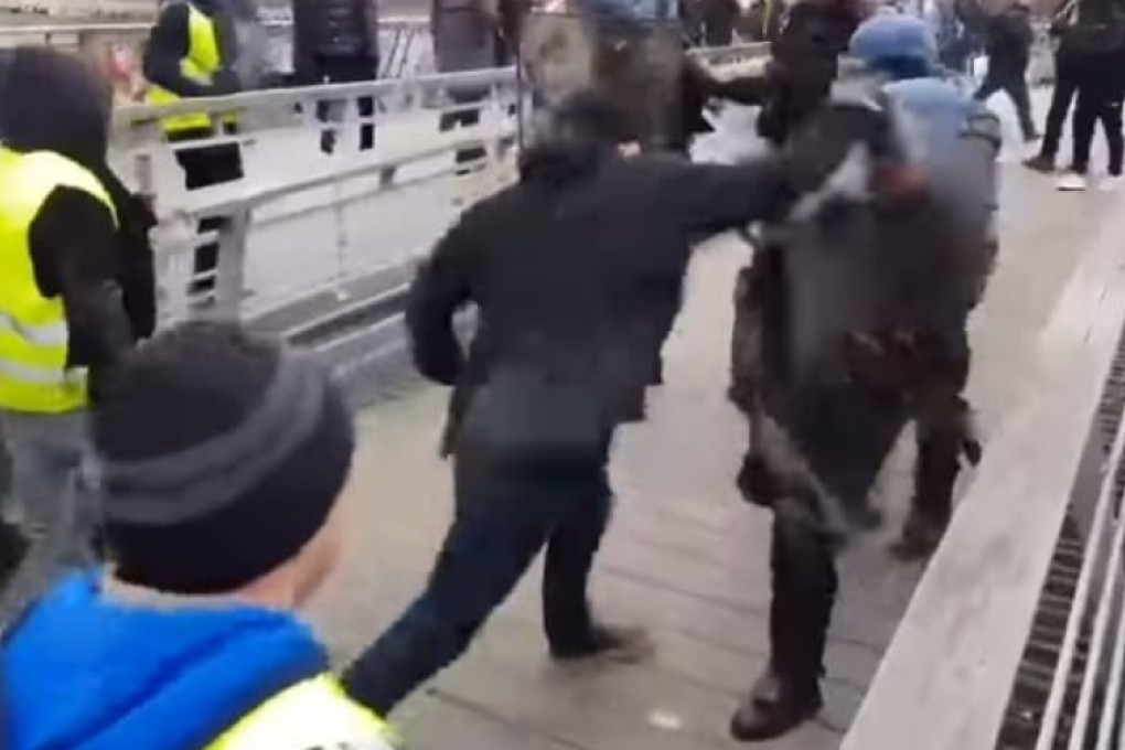 Christopher Dettinger lashes out at riot police in Paris. Photo: YouTube