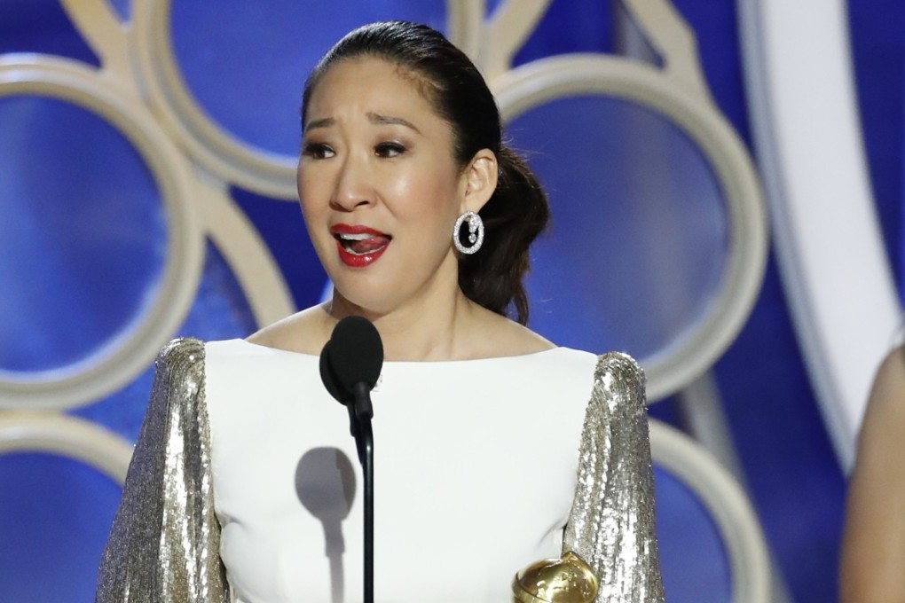 Golden Globes co-host Sandra Oh accepts the award for best actress in a drama series for her role in Killing Eve. Photo: Paul Drinkwater/NBC/AP