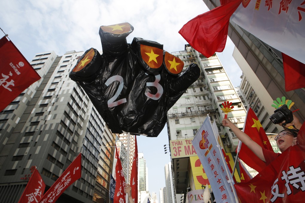 Protesters march against any plan to pass national security legislation under Article 23 of the Basic Law, on October 1. Photo: AP