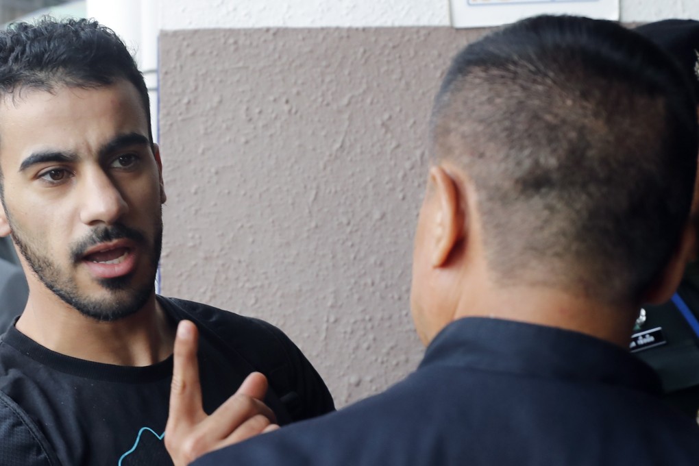 Hakeem al-Araibi with Thai immigration officials. Photo: EPA