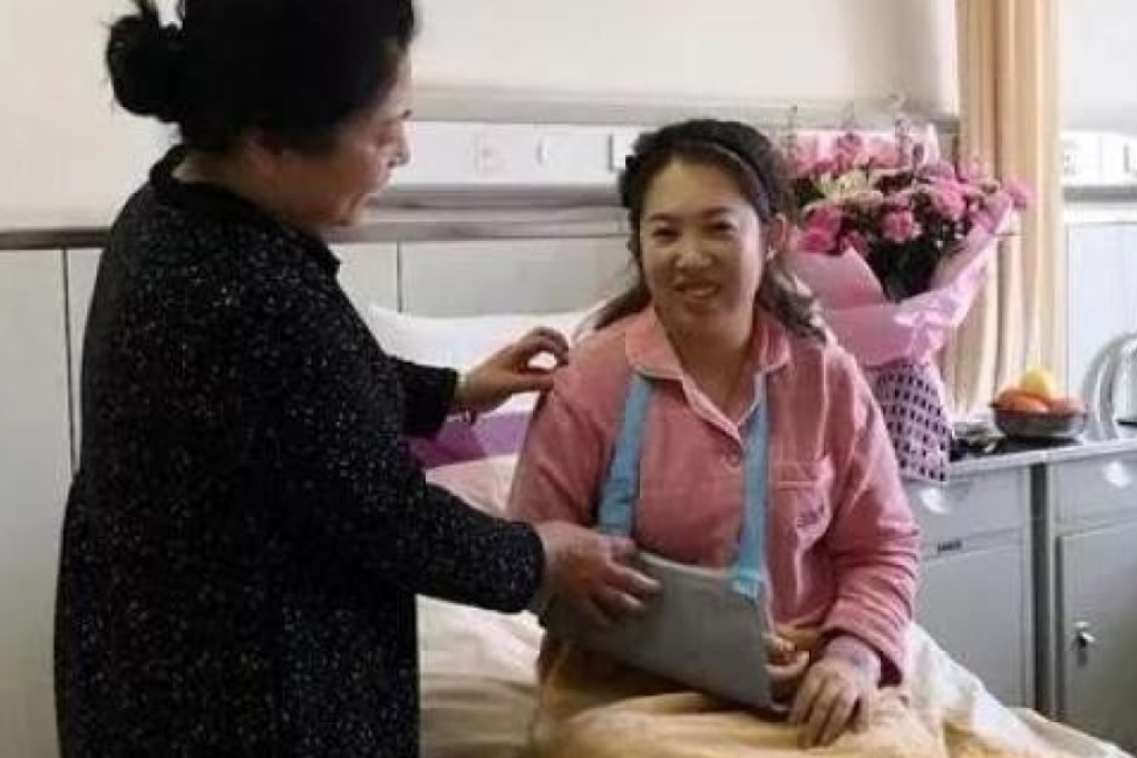 A slightly-built female nurse in China grabbed a much larger man by the arm and clung to him as he dangled out of a 13th floor hospital window until help arrived. Photo: Weibo.