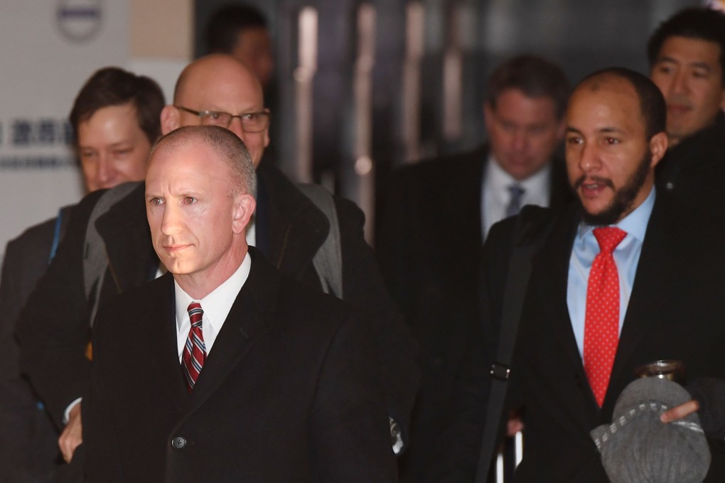 Deputy US trade representative Jeffrey Gerrish, left, leaves a hotel with his negotiation team for the second day of talks in Beijing on Tuesday. Photo: AFP