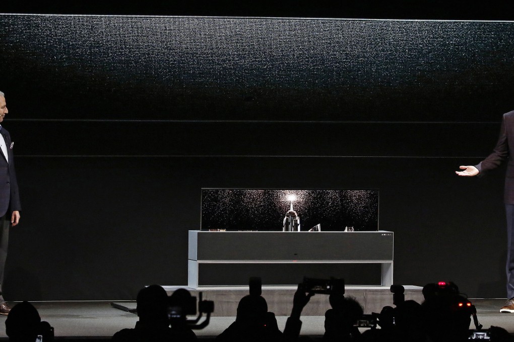 LG executives present LG’s rollable Signature OLED TV to media at the 2019 International Consumer Electronics Show in Las Vegas on Monday. Photo: EPA-EFE
