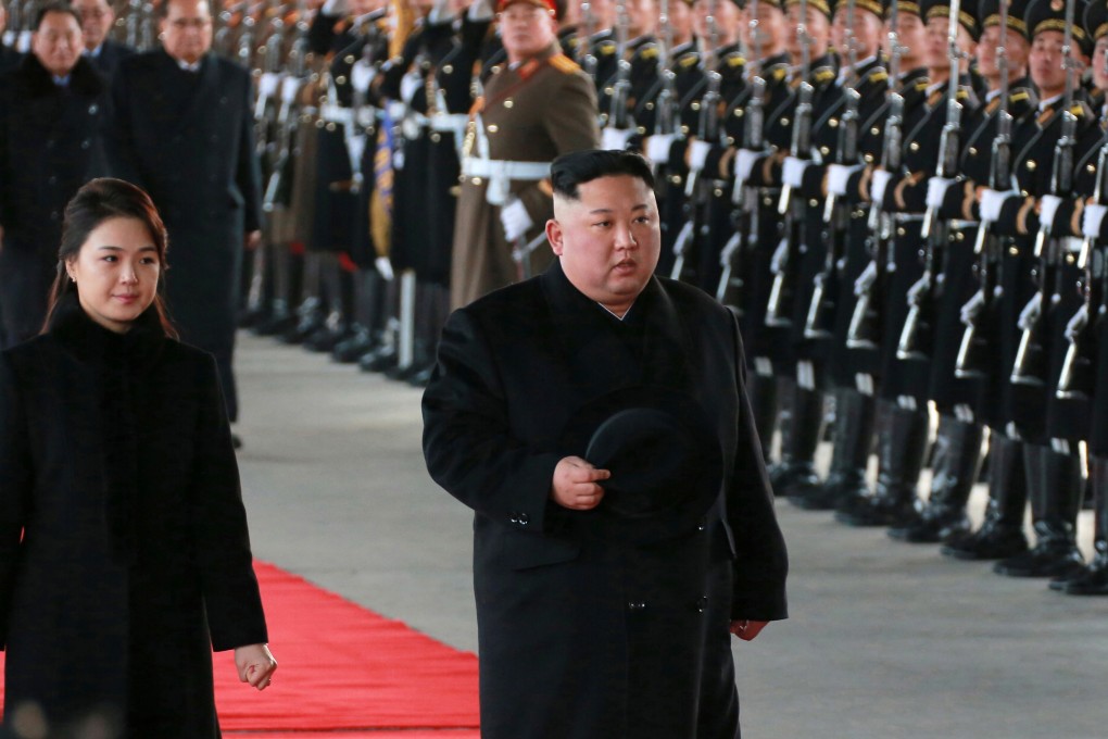 A photo released by the official North Korean Central News Agency on Monday shows North Korean leader Kim Jong-un and wife Ri Sol-ju reviewing a guard of honour as he leaves for China from Pyongyang. Photo: EPA
