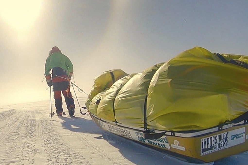 Colin O’Brady drags his sledge. Borge Ousland dragged his sledge too, but the use of a sail, no matter how small, means O’Brady can claim a first. Photos: Colin O’Brady via AP
