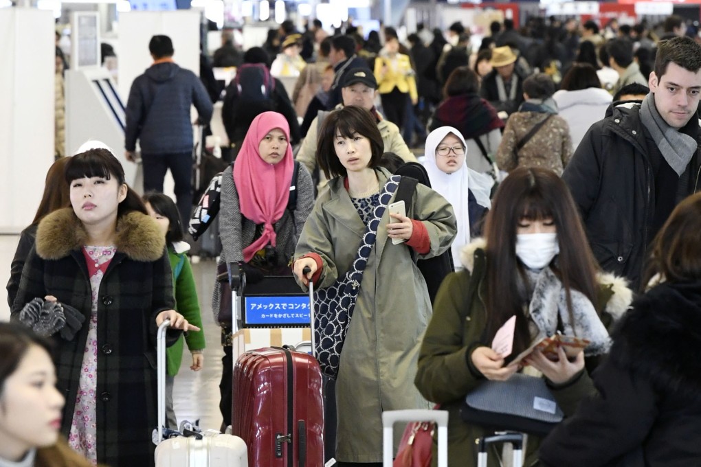 Passengers at Kansai International Airport on January 7. Photo: Kyodo