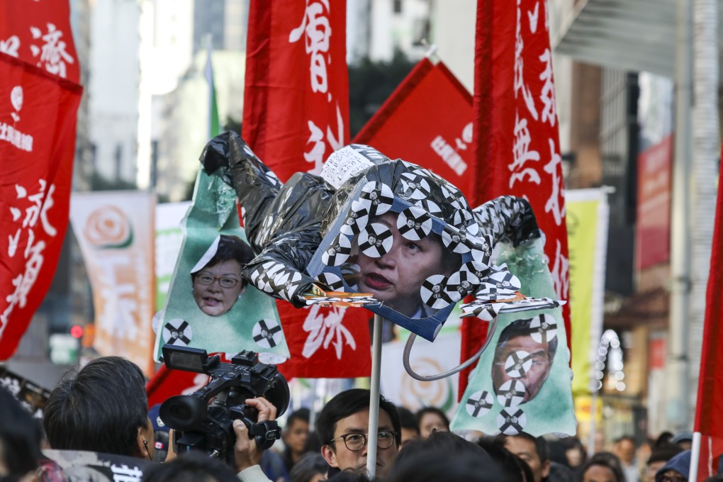 A prop featuring Secretary for Justice Teresa Cheng is seen at the New Year’s Day rally in Causeway Bay. Photo: Nora Tam