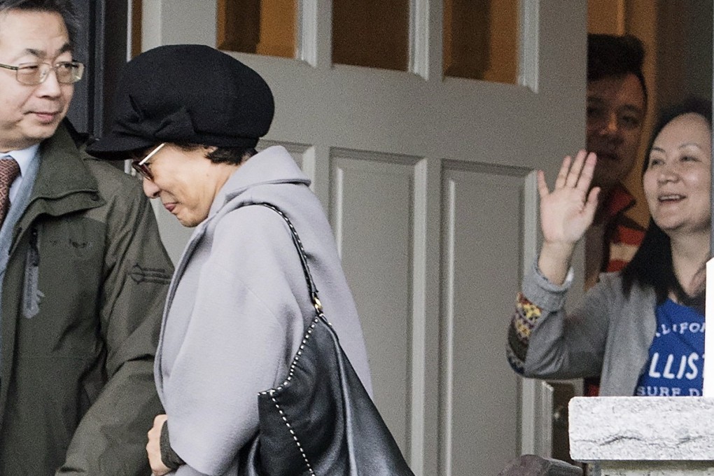 Meng Wanzhou waves goodbye to visitors at her home in Vancouver. A former US federal prosecutor thinks Donald Trump will get involved in her case as part of his trade war negotiations with China. Photo: AP