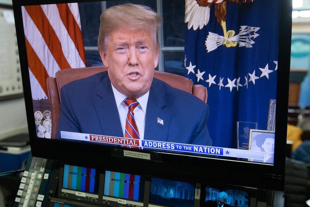 US President Donald Trump appears on a television screen in the Press Briefing Room of the White House. Photo: AFP