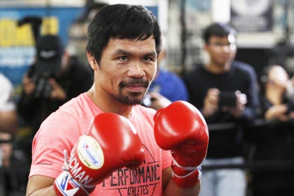 Manny Pacquiao poses at a boxing club in Los Angeles as he prepares for his WBA welterweight title fight against Adrien Broner. Photo: AP