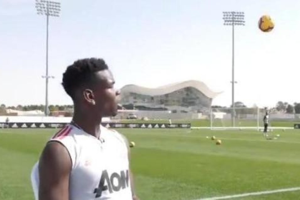 Paul Pogba gives an interview while a football comes his way. Photo: Twitter