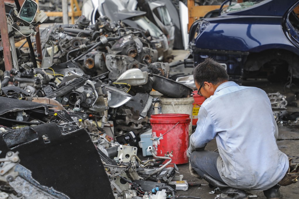 A man works at a recycling yard for vehicle parts operating on a brownfield site in Wang Toi Shan in Yuen Long in May 2018. The proposal to redevelop brownfield sites in the New Territories received strong public support in the Task Force on Land Supply’s public engagement exercise, but resettling existing businesses will be not be easy. Photo: Edward Wong