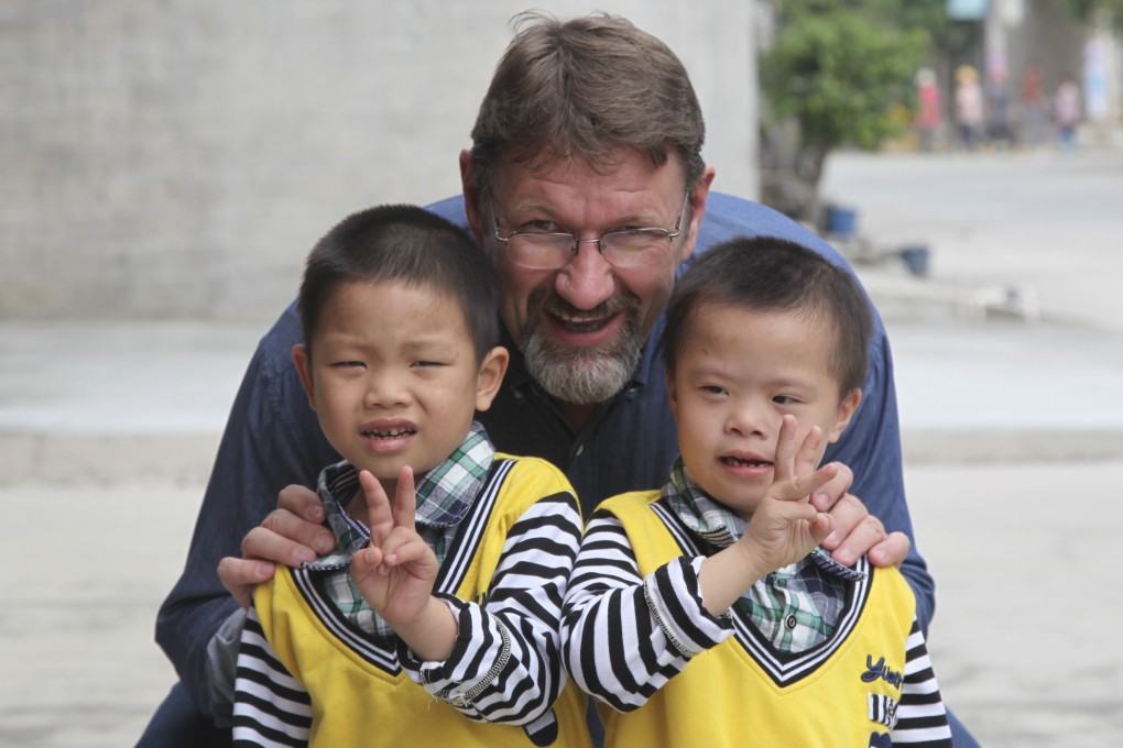 Robert Glover with children in Nanning, Guangxi, in 2014. Picture: Care for Children