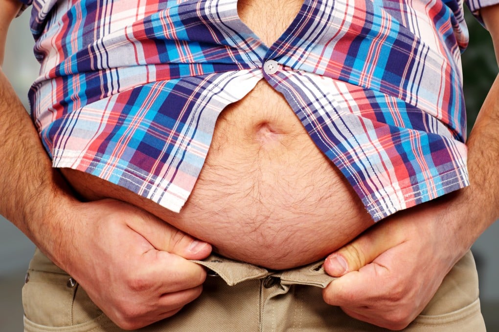 A stock photo of a man with a large belly. New research has linked a larger waist-to-hip ratio to smaller amounts of grey matter in the brain. Photo: Shutterstock