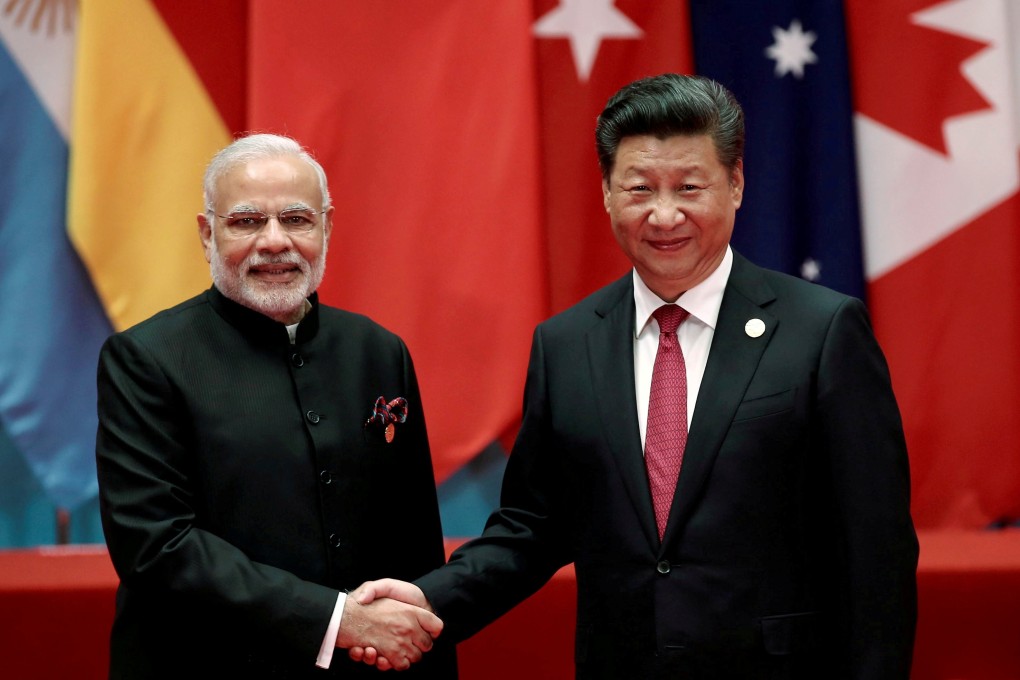 Chinese President Xi Jinping shakes hands with Indian Prime Minister Narendra Modi. Photo: Reuters