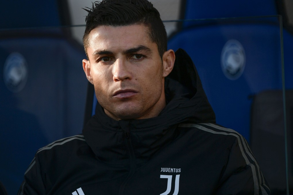 Cristiano Ronaldo looks on from the bench before Juventus’ match against Atalanta. Photo: AFP