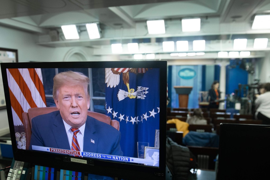 In this file photo taken on Tuesday, US President Donald Trump appears on a television screen in the Press Briefing Room of the White House in Washington, DC, as he speaks during a presidential address about the government shutdown and border security from the Oval Office. Photo: AFP