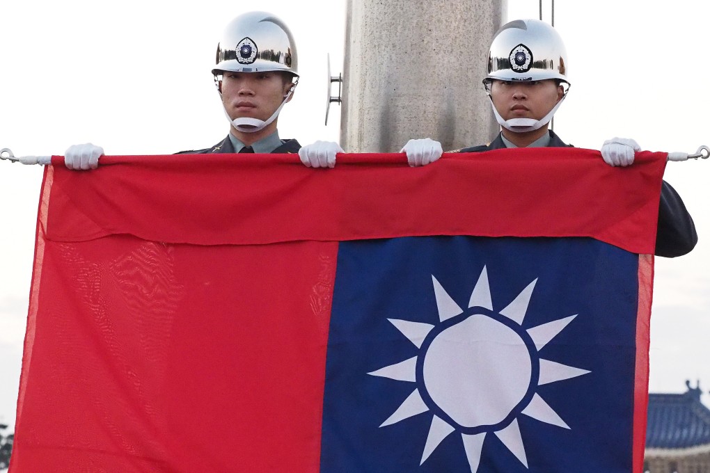 Soldiers perform a flag-lowering ceremony at Liberty Square in Taipei. Photo: EPA-EFE