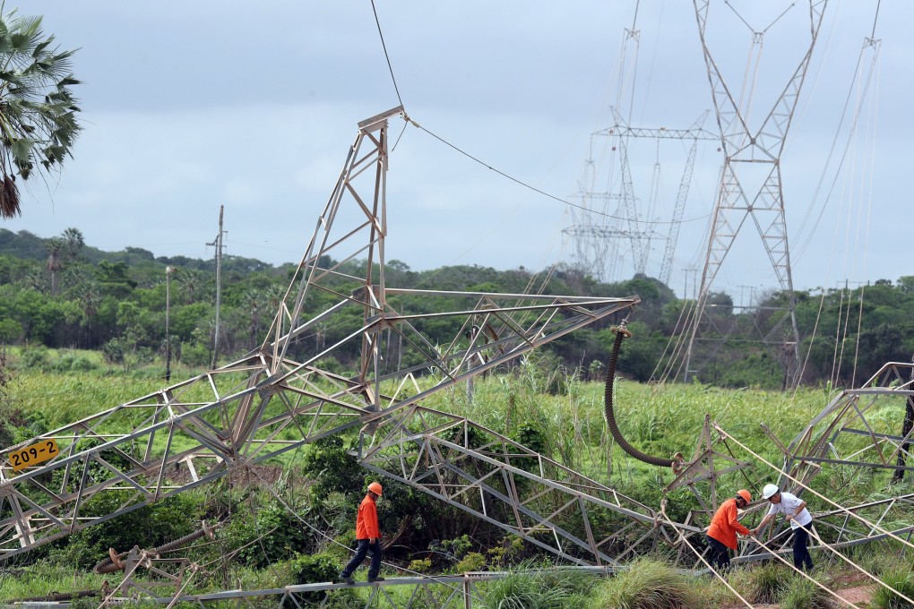 Technicians work on the site where a power transmission tower was damaged by a bomb in the outskirts of Fortaleza, Brazil January 12, 2019. Photo: Reuters