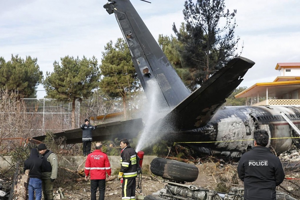Fire immediately engulfed the aircraft after it skidded off a runway and crashed into a wall separating the Fath Airport from a residential neighbourhood. Photo: AFP