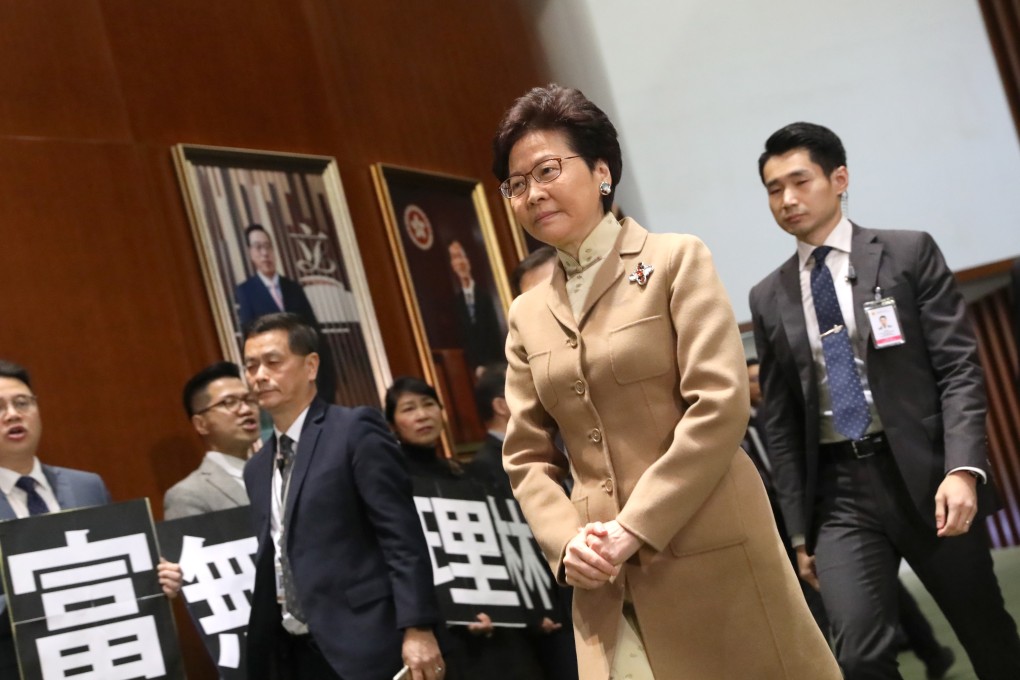 Pan democrats protest to Chief Secretary Carrie Lam Cheng Yuet-ngor as she walks into the Legislative Council Chamber. Photo: K.Y. Cheng