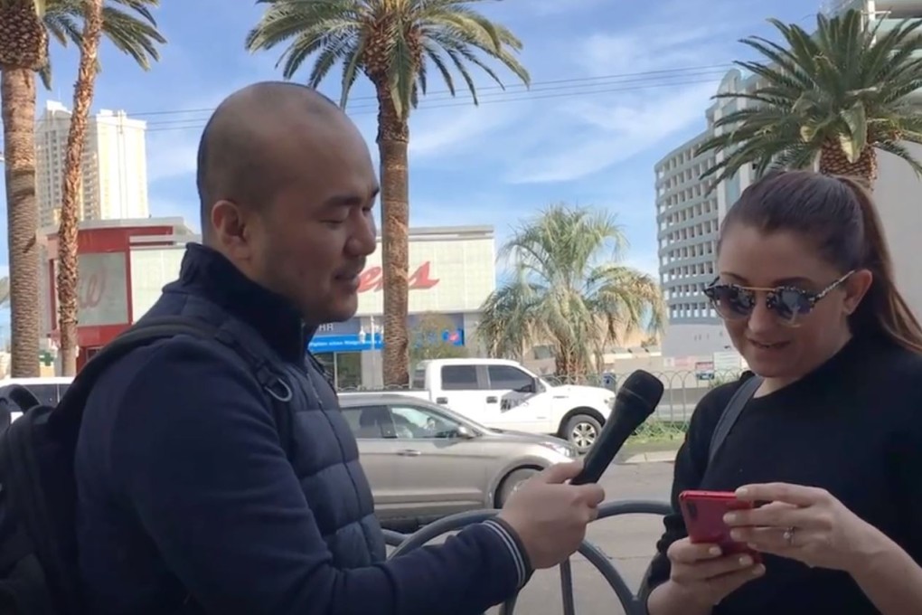 Post reporter Li Tao interviews passer-by in Las Vegas about Chinese smartphones
