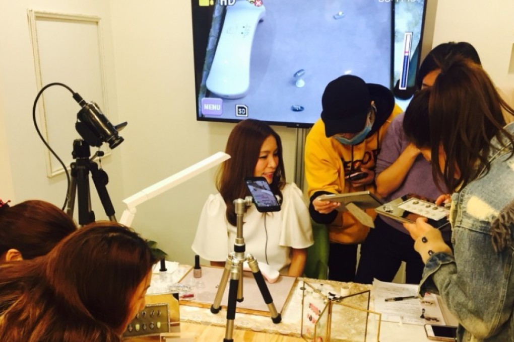 Naoko Takano at work with her team in Tokyo. Photo: Kyodo News/AP