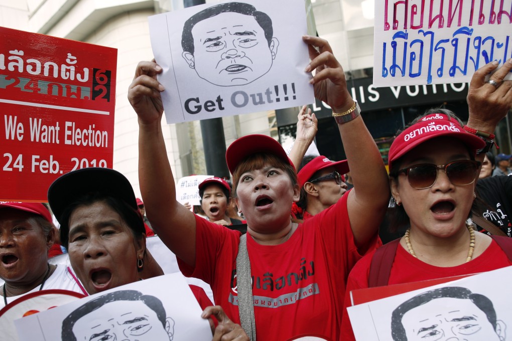 Pro-democracy demonstrators shout slogans during a rally to protest the possible delay of the general election in Bangkok, Thailand on Sunday. Photo: EPA