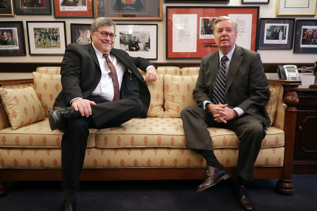 In this file photo taken last Wednesday, US attorney general nominee William Barr (left) poses before a meeting with US Senate Judiciary Committee member Lindsey Graham (right), in Graham’s office in the Russell Senate Office Building on Capitol Hill in Washington. Photo: AFP