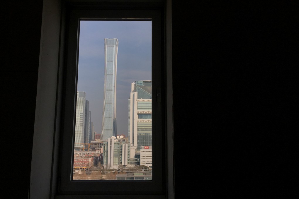 China Zun tower and other buildings are seen through a window in Beijing’s central business area. Photo: Reuters