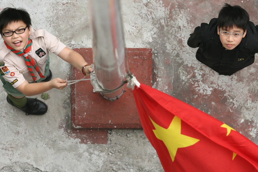 Students at a Hong Kong school practise raising the national flag. The national anthem bill aims to make insulting the song a criminal offence in Hong Kong, with a maximum penalty of a HK$50,000 fine and three years in prison. Photo: Oliver Tsang