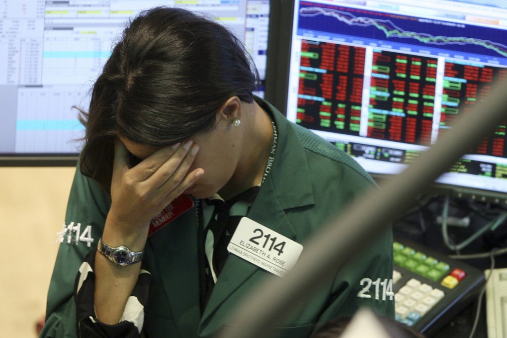 A specialist with Lehman Brothers reacts as the firm slides into bankruptcy in 2008. Photo: AP
