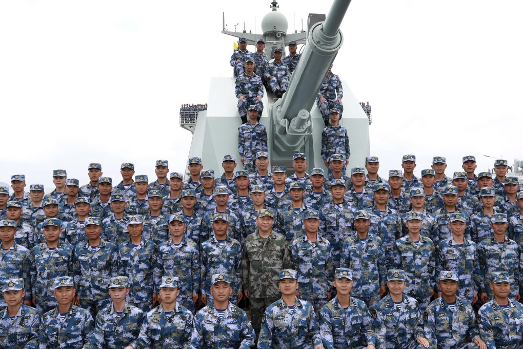 President Xi Jinping poses with soldiers on a navy ship last year as China continued its military exercises in the Taiwan Strait. Photo: AP