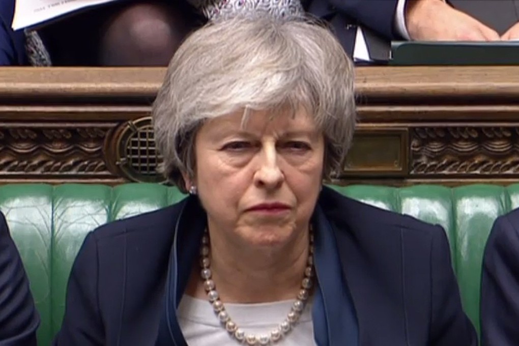 Britain’s Prime Minister Theresa May listens as Britain’s opposition Labour Party Leader Jeremy Corbyn speaks in the House of Commons in London on Tuesday. Photo: AFP