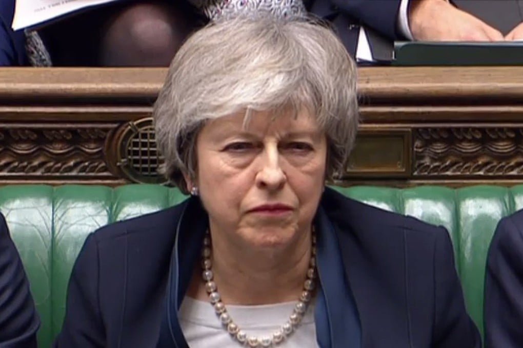 Britain’s Prime Minister Theresa May listens as Britain’s opposition Labour Party Leader Jeremy Corbyn speaks in the House of Commons in London on Tuesday. Photo: AFP