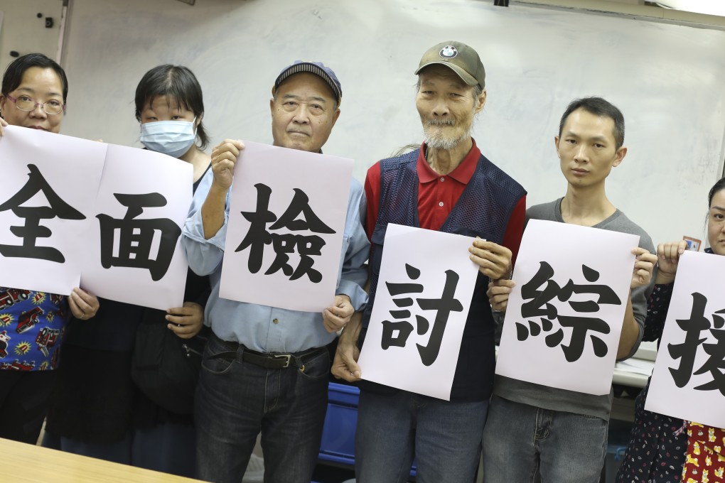 Yeung Suen (fourth from left), Lee Chi-yung (second from right) and fellow activists from the CSSA Alliance with a message calling for a complete review of the assistance scheme. Photo: K.Y. Cheng