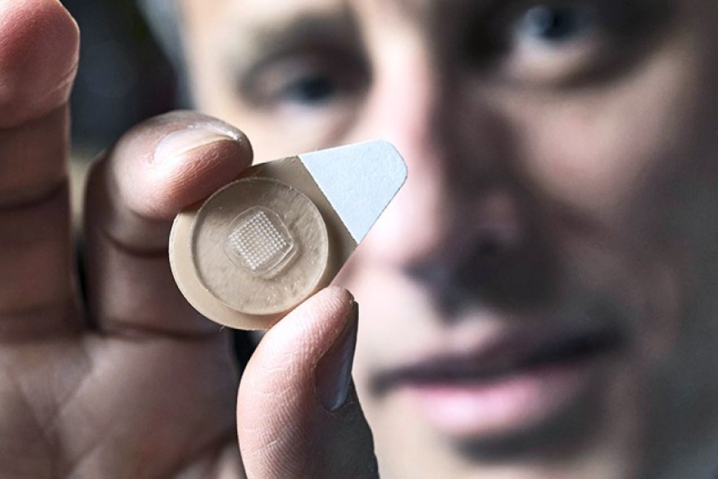Mark Prausnitz displays the microneedle contraceptive patch. Photo: Christopher Moore/Georgia Tech