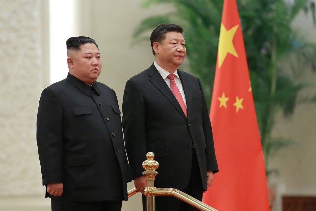 North Korea's leader Kim Jong-un stands alongside China's President Xi Jinping during a welcome ceremony at the Great Hall of the People in Beijing on January 8. Photo: KCNA via KNS/AFP