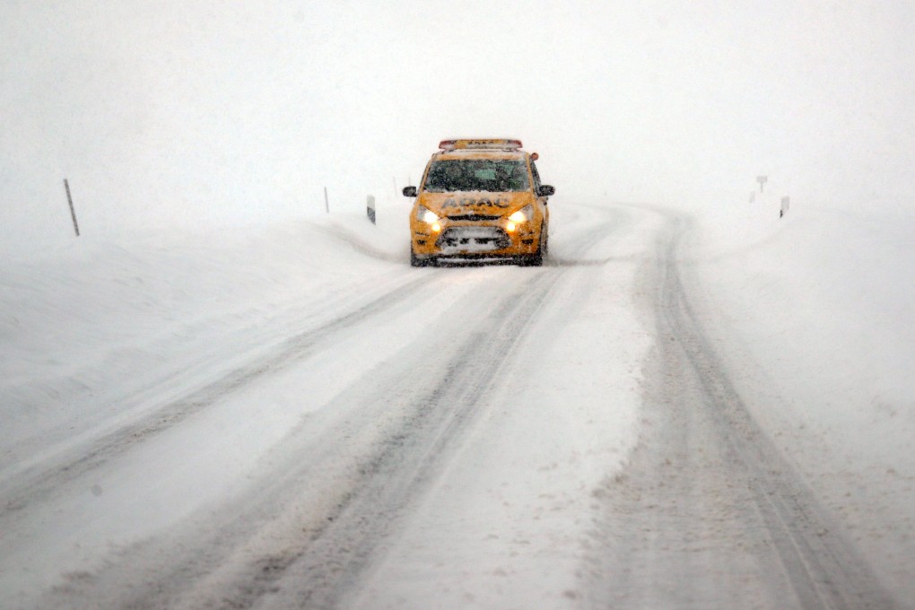 A car is seen after heavy snowfalls near Irschenberg, Germany. The German economy is getting the worst of both worlds: not only is the economy of China, Germany’s major trading partner, slowing down, the German car sector has also been hit by the EU’s latest emissions regulations. Photo: Reuters