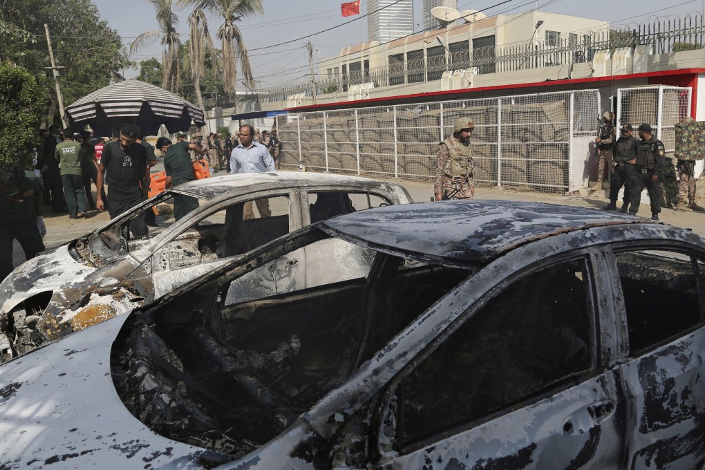 Pakistani security personnel assess conditions in the compound of Chinese consulate after a deadly attack, in Karachi. Photo: AP