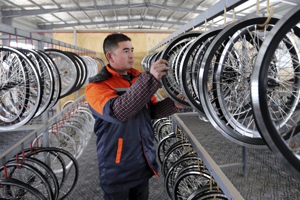 In this December 21, 2018, file photo, a worker checks electric bicycle parts for export in Huaibei in central China's Anhui province. Photo: AP