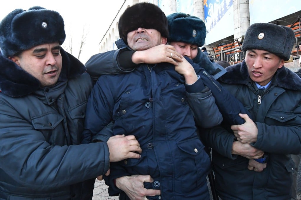 Kyrgyz police officers arrest a protester at an anti-Chinese rally in Ala-Too Square in Bishkek on Thursday. Photo: AFP