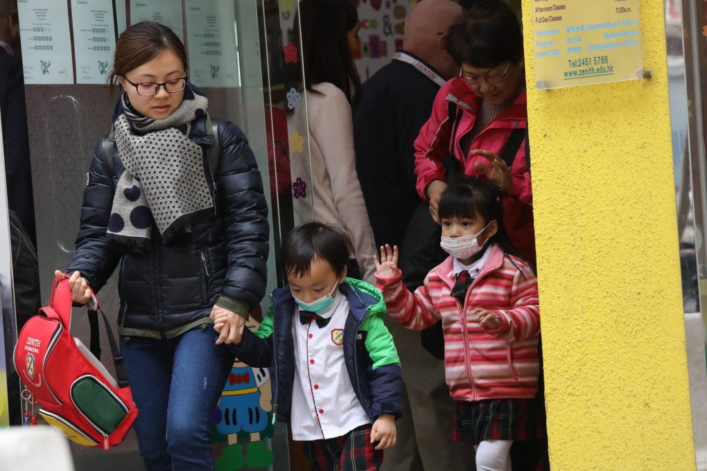 Parents and pupils leave a kindergarten in Tuen Mun at noon. Photo: K.Y. Cheng
