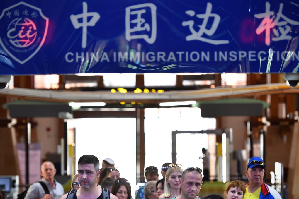 Russian tourists arrive at an immigration inspection checkpoint at the airport in Sanya, Hainan province, June 1, 2018. The island wants to become a tech hub too. Photo: Xinhua