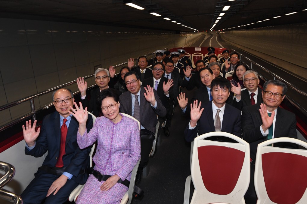 Chief Executive Carrie Lam and fellow government members travel on an open-top bus along the Central-Wan Chai Bypass tunnel, which opened on Saturday. It will open to motorists on Sunday. Photo: Handout
