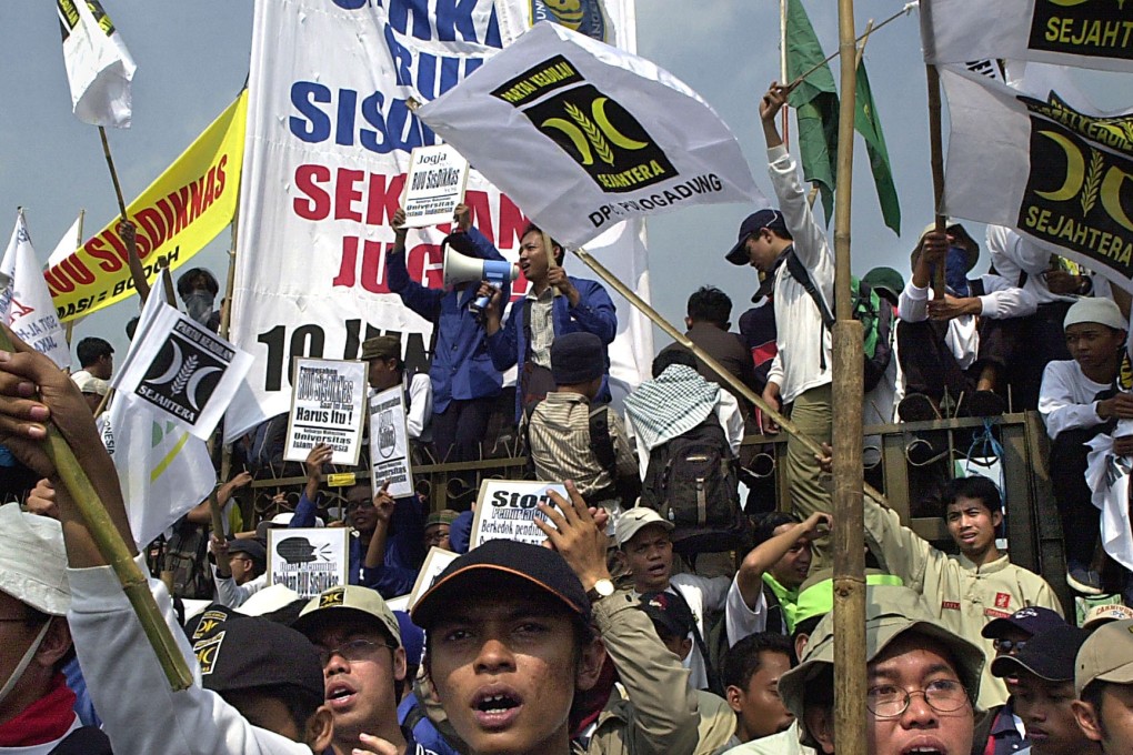 Demonstrators in Jakarta chant Islamic religious songs and wave banners reading “Save the religious community from apostasy”. Photo: AFP