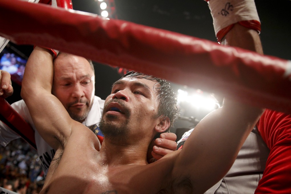 Manny Pacquiao celebrates his win against Adrien Broner in their WBA welterweight title fight in Las Vegas. Photo: AP